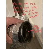 A close look at a dryer vent inside a client's home that is no up to "code."